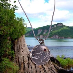 Wolf howls at the moon pendant. Sterling silver with genuine garnet moon. NWT